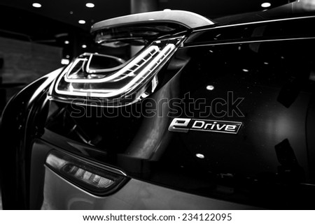 BERLIN - NOVEMBER 28, 2014: Showroom. The rear lights of the car BMW i8, first introduced as the BMW Concept Vision Efficient Dynamics, is a plug-in hybrid sports car developed by BMW. Black and white