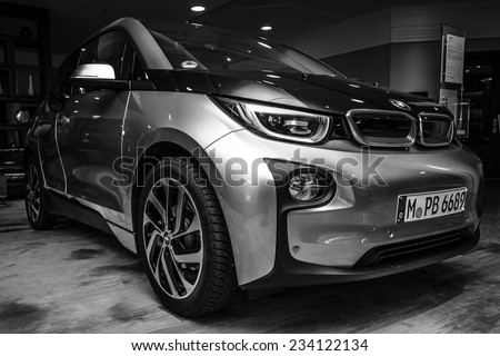 BERLIN - NOVEMBER 28, 2014: Showroom. The BMW i3, previously Mega City Vehicle (MCV), is a five-door urban electric car developed by the German manufacturer BMW. Black and white.
