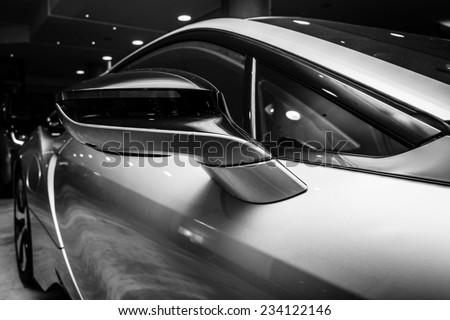BERLIN - NOVEMBER 28, 2014: Showroom. A fragment of the car BMW i8, first introduced as the BMW Concept Vision Efficient Dynamics, is a plug-in hybrid sports car developed by BMW. Black and white.