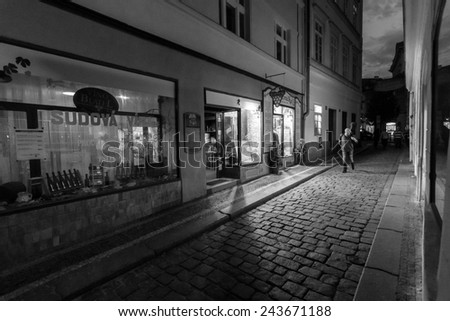 PRAGUE, CZECH REPUBLIC - SEPTEMBER 19, 2014: Evening street in the old town. Black and white. Prague is the capital and largest city of the Czech Republic.