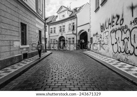 PRAGUE, CZECH REPUBLIC - SEPTEMBER 19, 2014:  The lanes of the old city. Black and white. Prague is the capital and largest city of the Czech Republic.