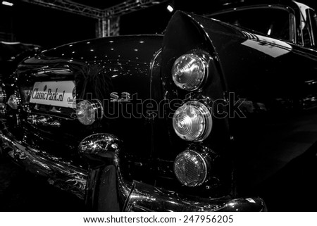 MAASTRICHT, NETHERLANDS - JANUARY 08, 2015: The rear brake lights of a full-size luxury car Bentley S3 Continental. Black and white. International Exhibition InterClassics & Topmobiel 2015