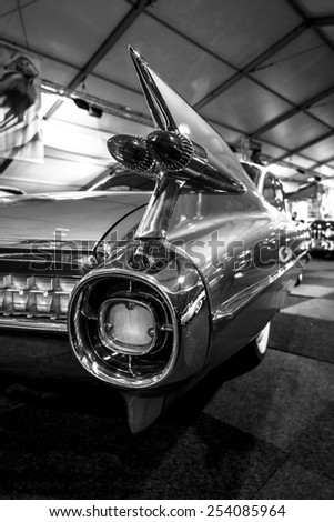 MAASTRICHT, NETHERLANDS - JANUARY 08, 2015: The rear brake lights a full-size luxury car Cadillac Coupe de Ville, 1959. Black an white. International Exhibition InterClassics & Topmobiel 2015