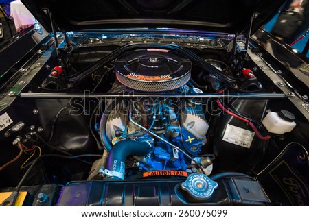 MAASTRICHT, NETHERLANDS - JANUARY 09, 2015: The engine V8 4700cc (289CUI HiPO) of Ford Mustang Shelby 350 GT in the original illumination, 1966. International Exhibition InterClassics & Topmobiel 2015