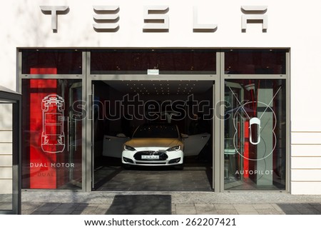 BERLIN - MARCH 08, 2015: Showroom company of Tesla Motors on Kurfurstendamm. Tesla Motors, Inc. is an American company that designs, manufactures, and sells electric cars.
