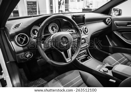 BERLIN - JANUARY 24, 2015: Showroom. Interior of a compact car Mercedes-Benz A200 CGI BE. Black and white. Produced since 2013.