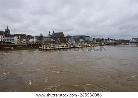MAASTRICHT, NETHERLANDS - JANUARY 09, 2015: View of Maastricht city centre and the Meuse river. Maastricht is the oldest city of the Netherlands and the capital city of the province of Limburg.