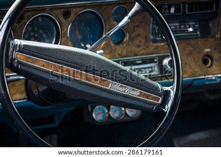 PAAREN IM GLIEN, GERMANY - MAY 23, 2015: Cabin of the personal luxury car, Chevrolet Monte Carlo. Focus on the foreground. The oldtimer show in MAFZ.