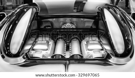 BERLIN - SEPTEMBER 04, 2012: Showroom. The engine compartment of the Bugatti Veyron EB 16.4 is a mid-engined grand touring car. Black and white. Bugatti Veyron - the fastest car in the world.