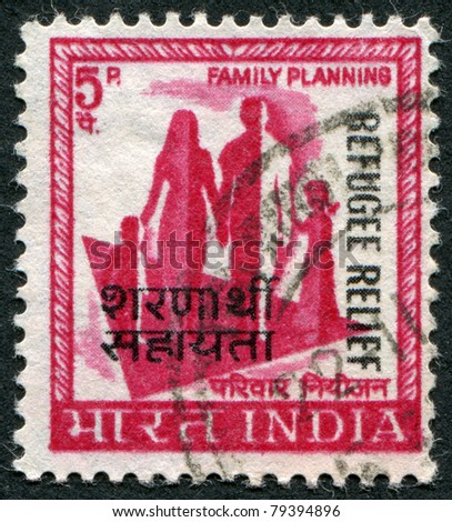 INDIA - CIRCA 1967: A stamp printed in India, shows a symbol of family planning campaign (overprint in 1971, to help refugees from East Pakistan), circa 1967