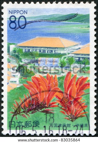 JAPAN - CIRCA 2000: A stamp printed in Japan, prefecture Okinawa, depicts a conference center Bankoku Shinryokan and flowering Erythrina variegata, circa 2000