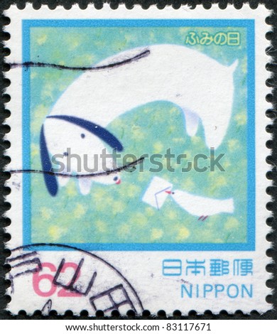 JAPAN - CIRCA 1992 A stamp printed in Japan, dedicated to the Letter Writing Day, illustrates the bird brings a letter to the dog, circa 1992