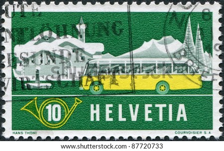 SWITZERLAND - CIRCA 1953: A stamp printed in Switzerland, shows the Alpine Post Bus, Winter Background, circa 1953