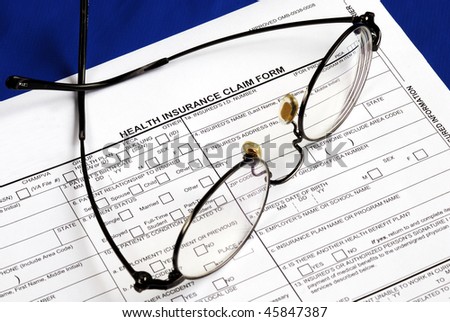 Fill the health insurance claim form isolated on blue