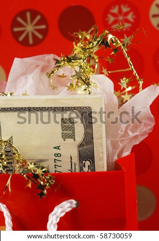 Money in a red gift bag concepts of gift of money