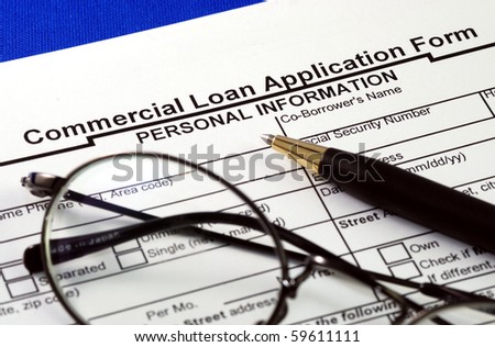 File the commercial loan application isolated on blue