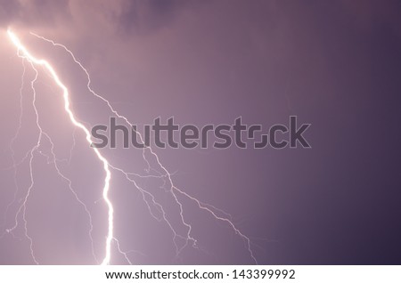 Summer storm with thunder, lightnings and rain.