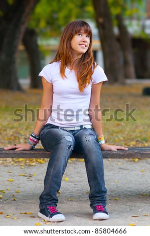 Beautiful Teenage Girl In Fashionable Warn Out Jeans, T-Shirt And ...