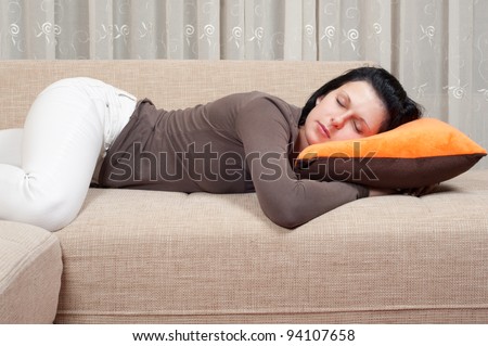 Pretty women sleeping on the couch