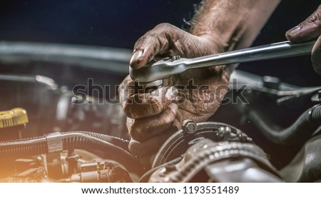 Similar – Image, Stock Photo Close up shot of bartender hands preparing negroni cocktail with grapefruit. He is putting some essence from grapefruit skin into the cocktail glass on counter.