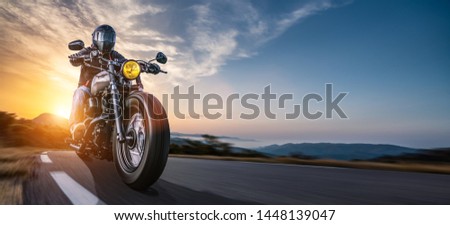 Similar – Foto Bild Motorradfahren bei Sonnenuntergang auf der leeren Straße bei einer Motorradtour. copyspace für Ihren individuellen Text.