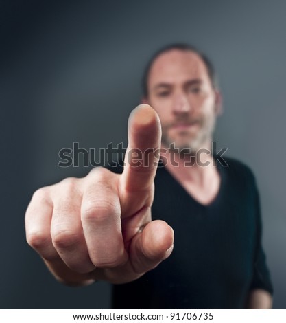 Close-up of a man touching a transparent screen