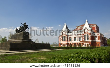 Building of the Drama Theatre, built in traditional Russian style and monument to the cavalry. Urban landscape. Russia, Samara.
