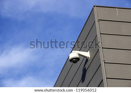 Security camera overlooking an industrial building