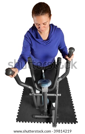 Young woman on a cross trainer on isolated white - shot from above