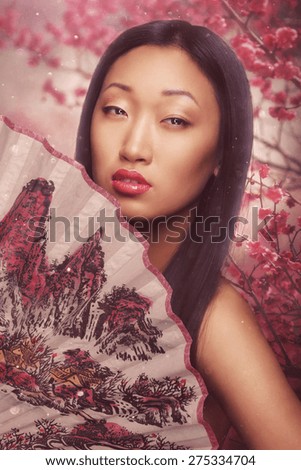 Beautiful asian woman with fan