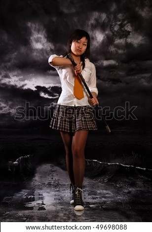 Beautiful japan schoolgirl with katana in her hands