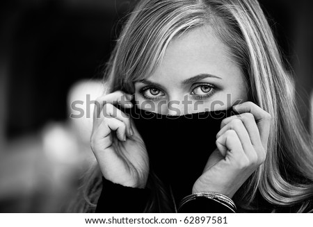Blond woman hide her face