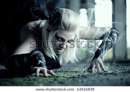 Gothic woman creep on the floor
