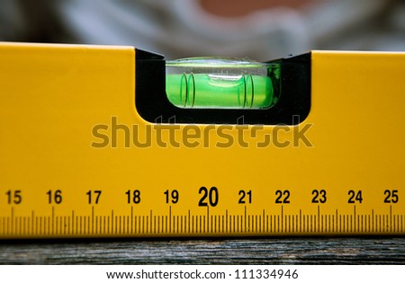Detail of spirit level on a wooden surface