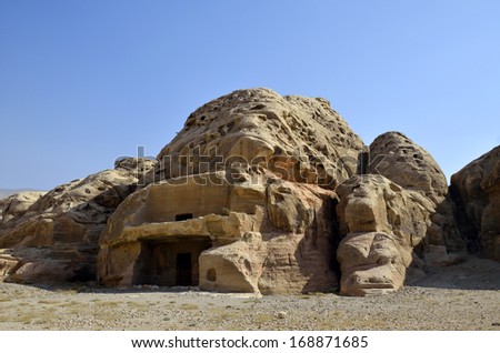 Ancient stone tombs in National park Little Petra, Jordan.