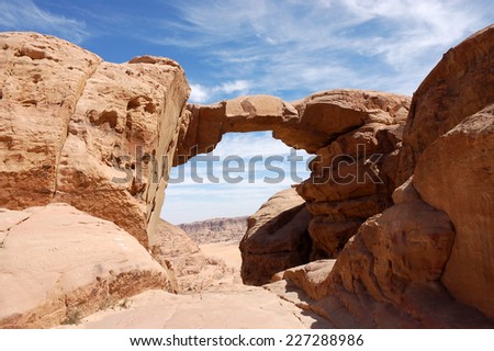 Burdah Arch over deep gorge in Wadi Rum desert, Jordan.