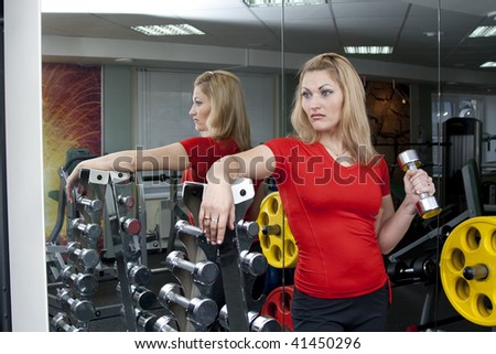 Working out with weights at a health club.