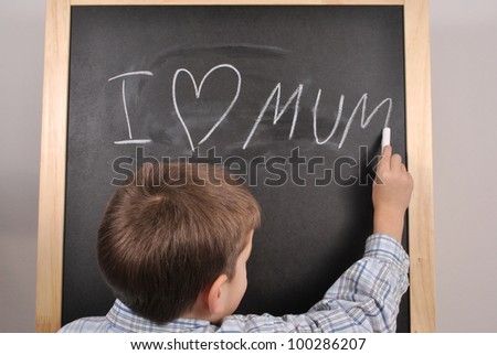 The little boy is presenting his feeling on the blackboard