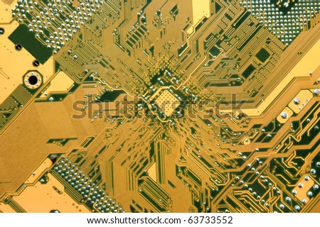 A close up of a yellow computer circuit.