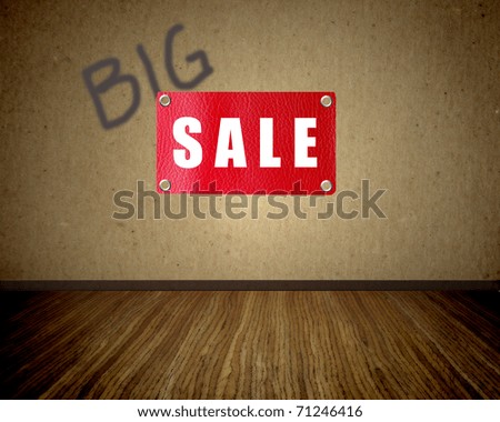 Beige wall wooden floor with a red sign of sale