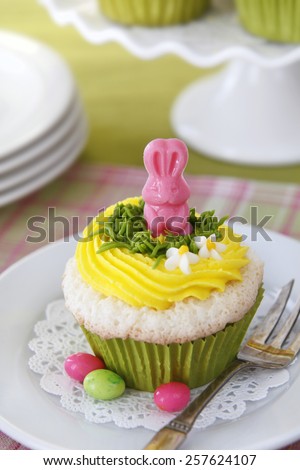 Easter cupcakes. Angel food cake with vanilla frosting and a candy bunny.