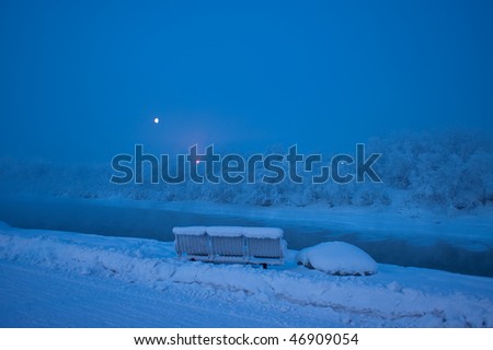 During morning twilight the temperature was 25 to 30 degrees below zero. It brought lots of freezing fog near the river with a beautiful moon set in the background.