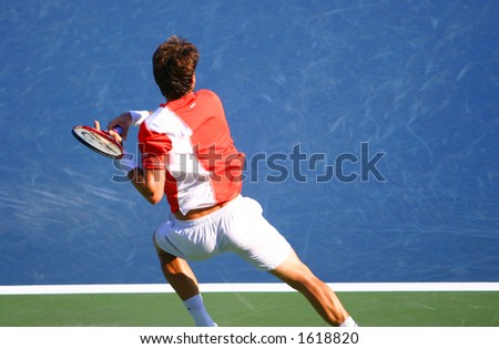 Tennis player hitting a backhand shot.