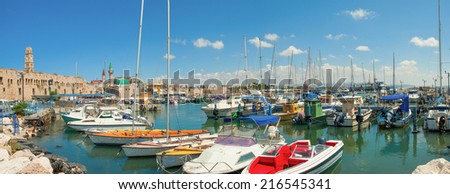 Acre, Israel - September 9, 2014:  Port of Acre, Israel. with boats mosque and the old city in the background.