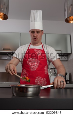 Cook singing and cooking in the kitchen.