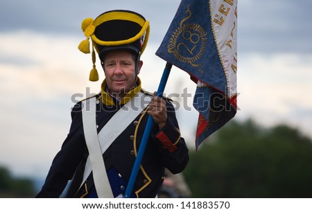 BADAJOZ REGION, SPAIN - MAY 18: French flag bearer at re-enactment of Albuera battle between French and allied nations armies in 1811. May 18, 2013 in La Albuera, Badajoz, Spain