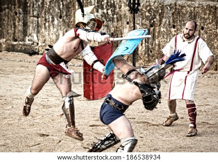 MERIDA, SPAIN,  APRIL 5: performing of gladiators fighting of Merida\'s Amphitheater on April 05, 2014 in Merida, Spain. Thracian and Mirmillo fight