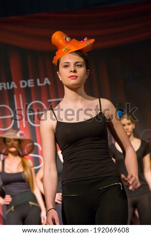 BADAJOZ , SPAIN , MARCH 2: Head dress catwalk at the Pasarela Market celebrated during the IV Beauty, Cosmetics and Health Exhibition on March 2, 2013 in Badajoz, Spain