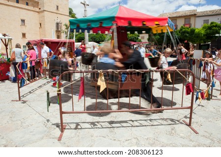 PASTRANA, SPAIN: 20 JULY: Human powered carousel at Ducal Festival of Pastrana, Guadalajara. On july 20, 2014.