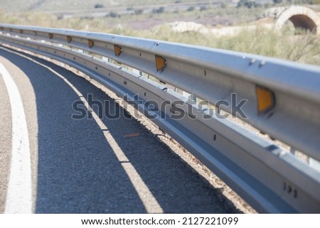 Guardrails poles covered crash-absorber beam. Shoulder view. Motorists safety concept Сток-фото © 